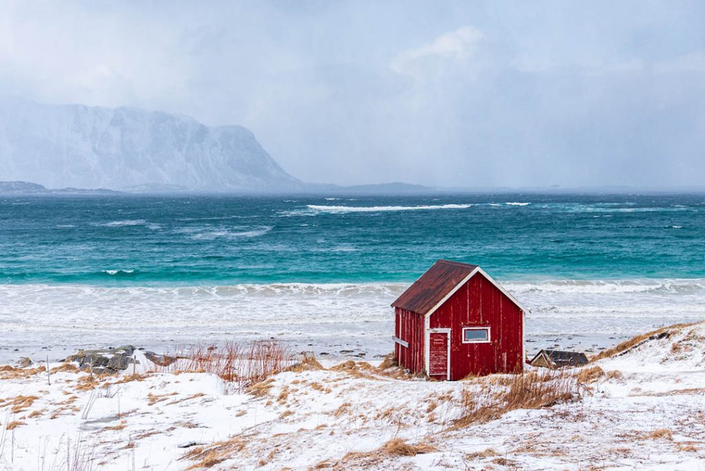small beach house is bravely facing the oncoming snowstorm